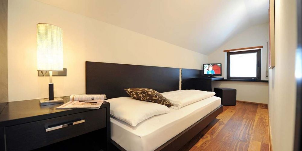 Penthouse designer suite with panoramic alpine view at Vier Jahreszeiten hotel