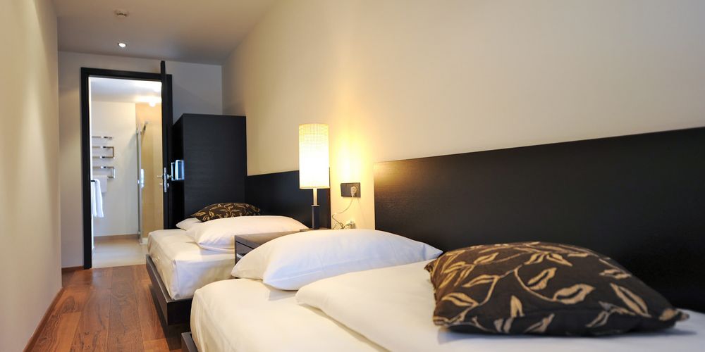 Luxury penthouse designer suite bedroom at Vier Jahreszeiten hotel in South Tyrol