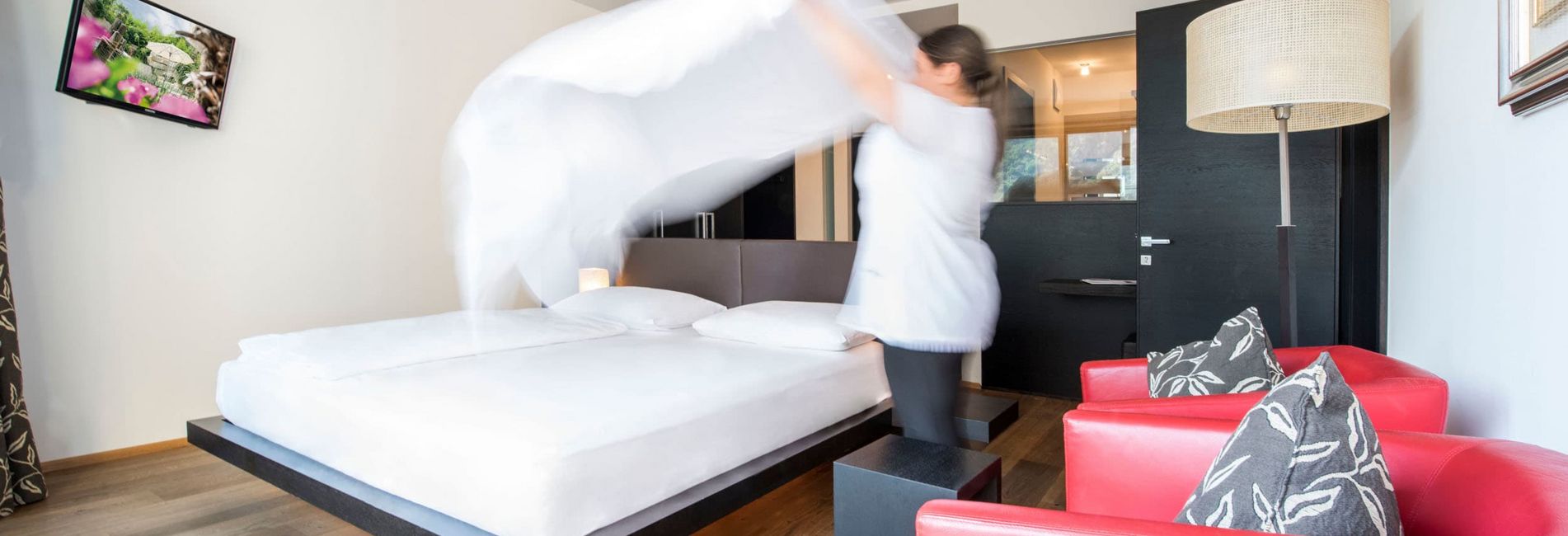 Modern hotel room with double bed and balcony at Vier Jahreszeiten hotel in South Tyrol Modern hotel room with double bed and balcony at Vier Jahreszeiten hotel in South Tyrol