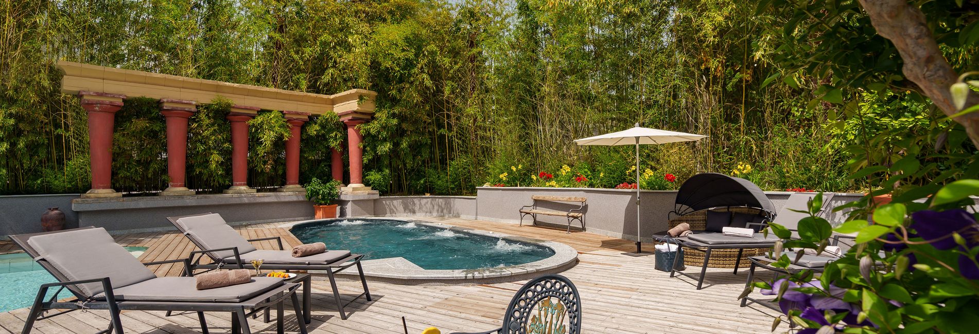 Outdoor pool at Hotel Vier Jahreszeiten South Tyrol with mountain view in summer Outdoor pool at Hotel Vier Jahreszeiten South Tyrol with mountain view in summer