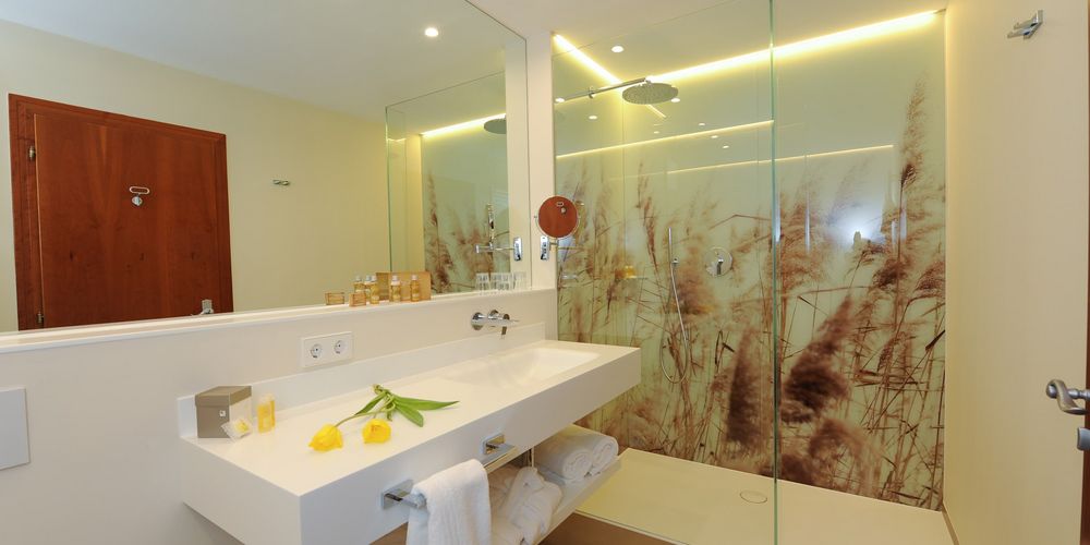 Family room bathroom with modern design at Vier Jahreszeiten Hotel in South Tyrol