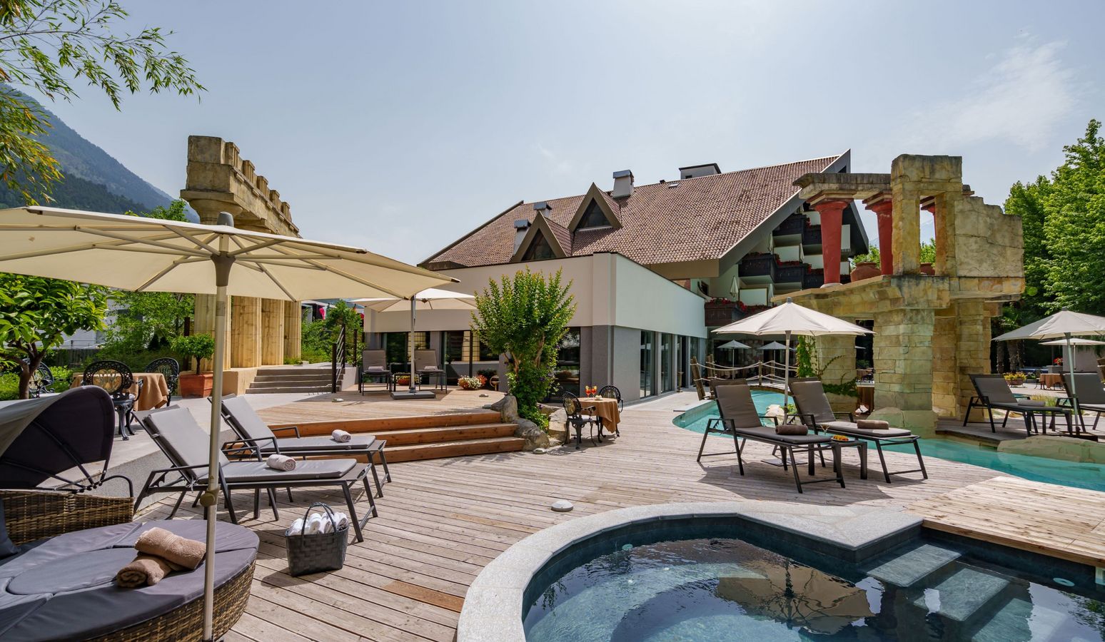 Outdoor swimming pool at Hotel Vier Jahreszeiten with mountain view in South Tyrol Outdoor swimming pool at Hotel Vier Jahreszeiten with mountain view in South Tyrol