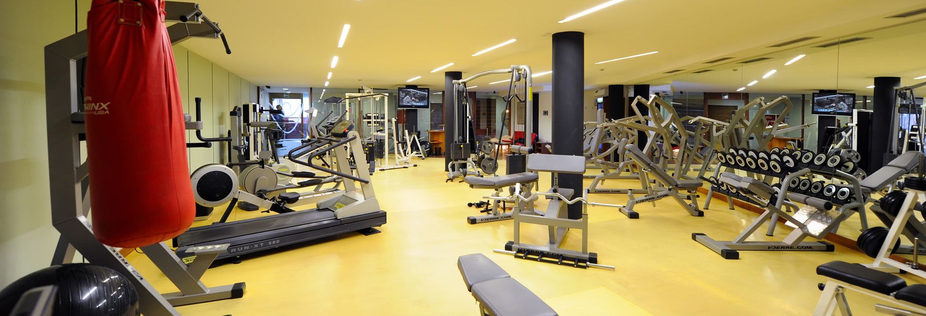 Modern fitness room at Hotel Vier Jahreszeiten in Schlanders with gym equipment Modern fitness room at Hotel Vier Jahreszeiten in Schlanders with gym equipment