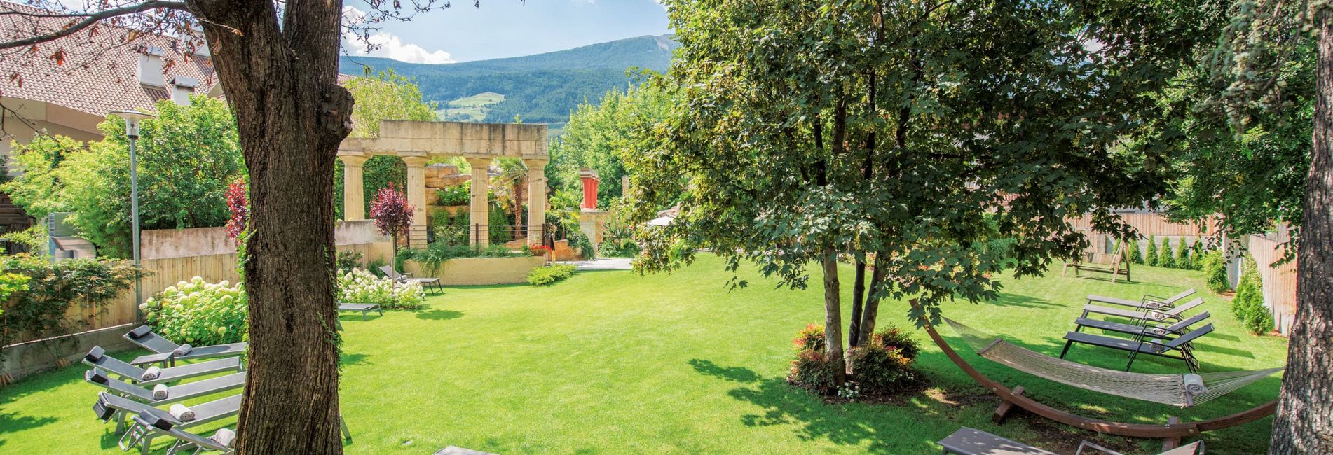 sunbathing lawn and relaxing garden at Vier Jahreszeiten Hotel in Schlanders, South Tyrol sunbathing lawn and relaxing garden at Vier Jahreszeiten Hotel in Schlanders, South Tyrol