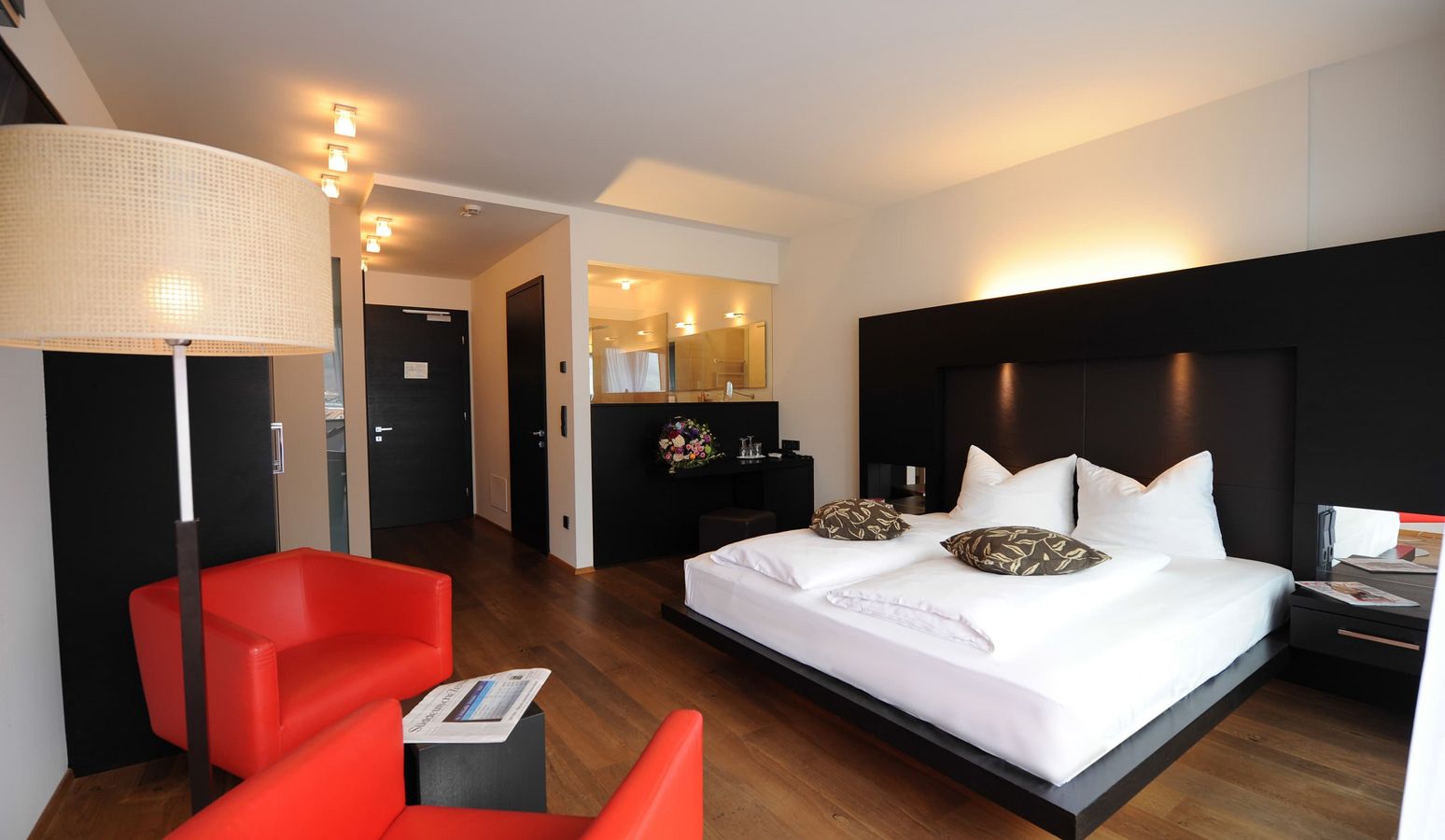 Designer penthouse bedroom at Vier Jahreszeiten hotel with modern interior and cozy atmosphere Designer penthouse bedroom at Vier Jahreszeiten hotel with modern interior and cozy atmosphere